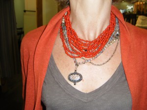 layering necklaces can help spice up an outfit