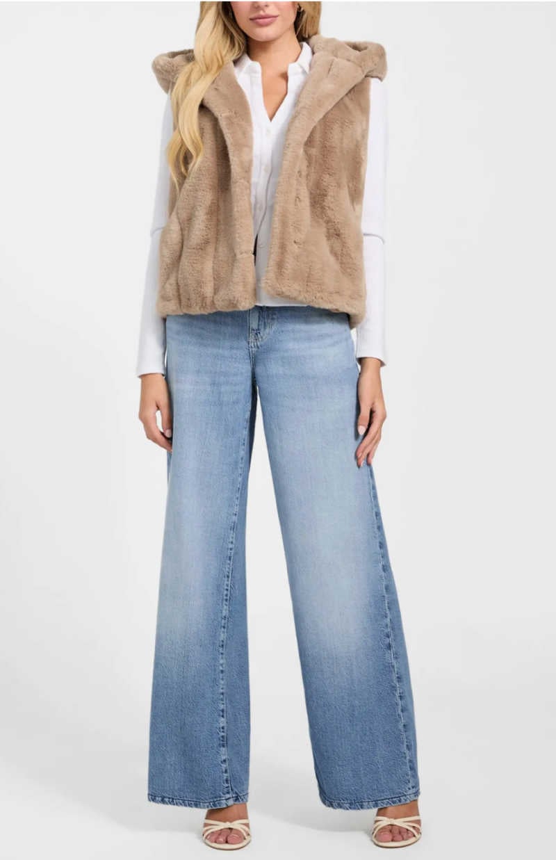 taupe fur vest over white shirt and jeans