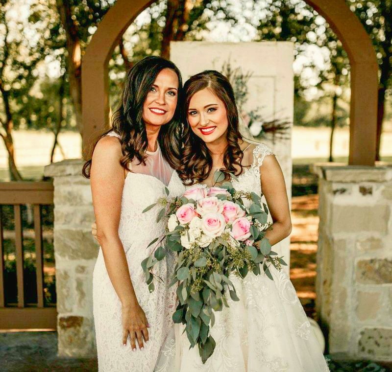 mother of the bride dress in pink lace with bride
