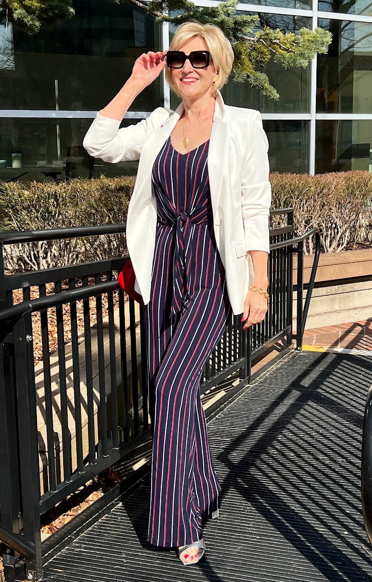 striped navy jumpsuit with white jacket