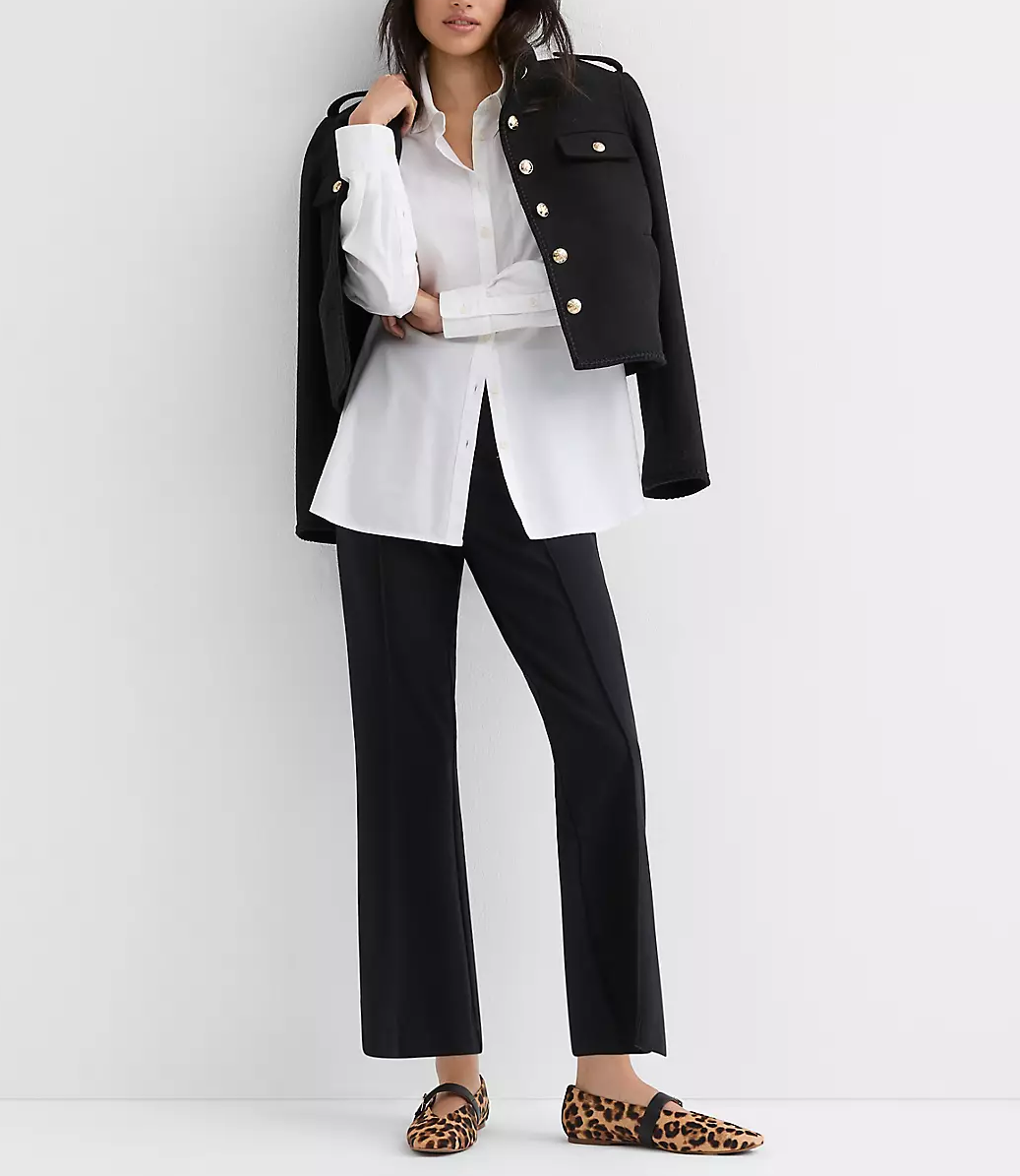 WOMAN WEARING WHITE BUTTON DOWN WITH BLACK PANTS AND A BLAZER THAT WOULD LOOK GREAT FOR DINNER IN NYC