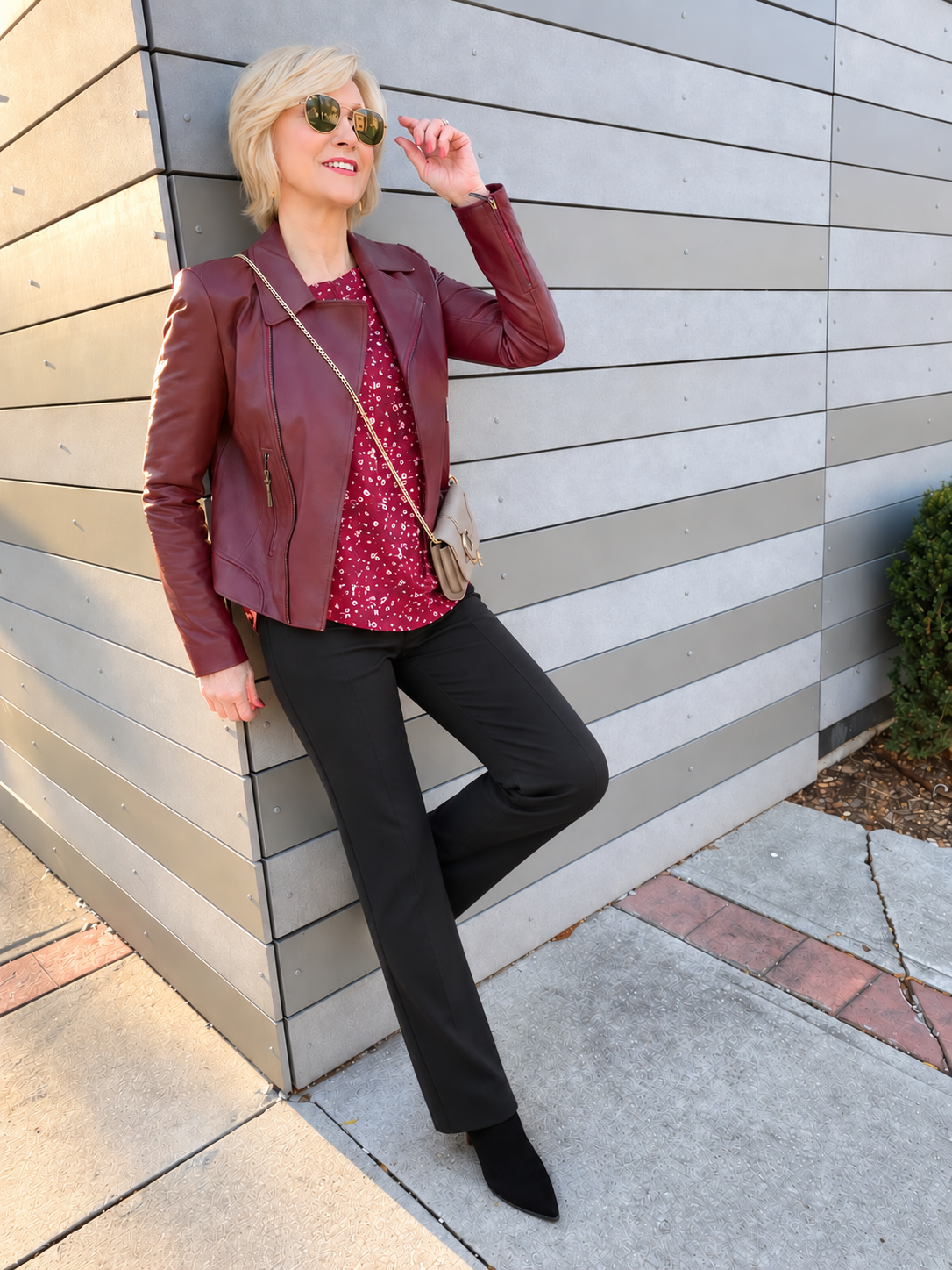 burgundy leather jacket with burgundy blouse and straight leg pants