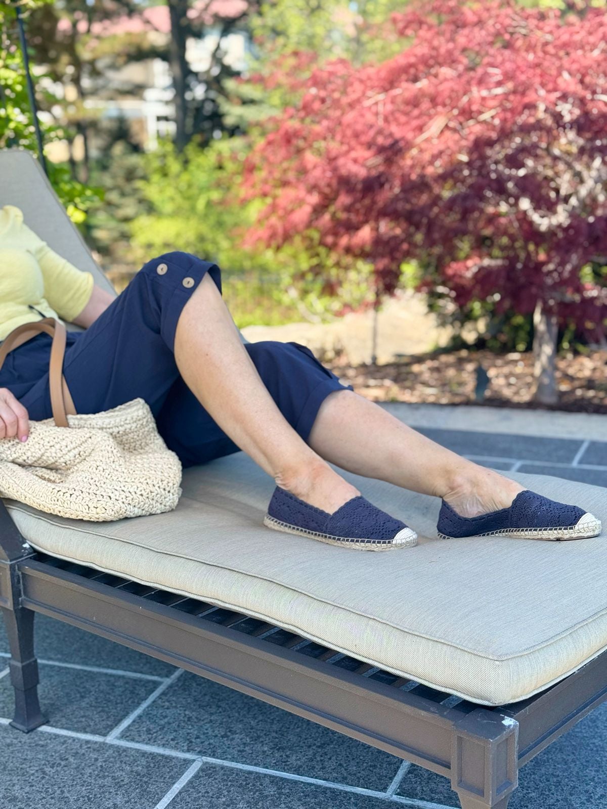 Navy espadrilles worn with navy capri pants for a casual chic look