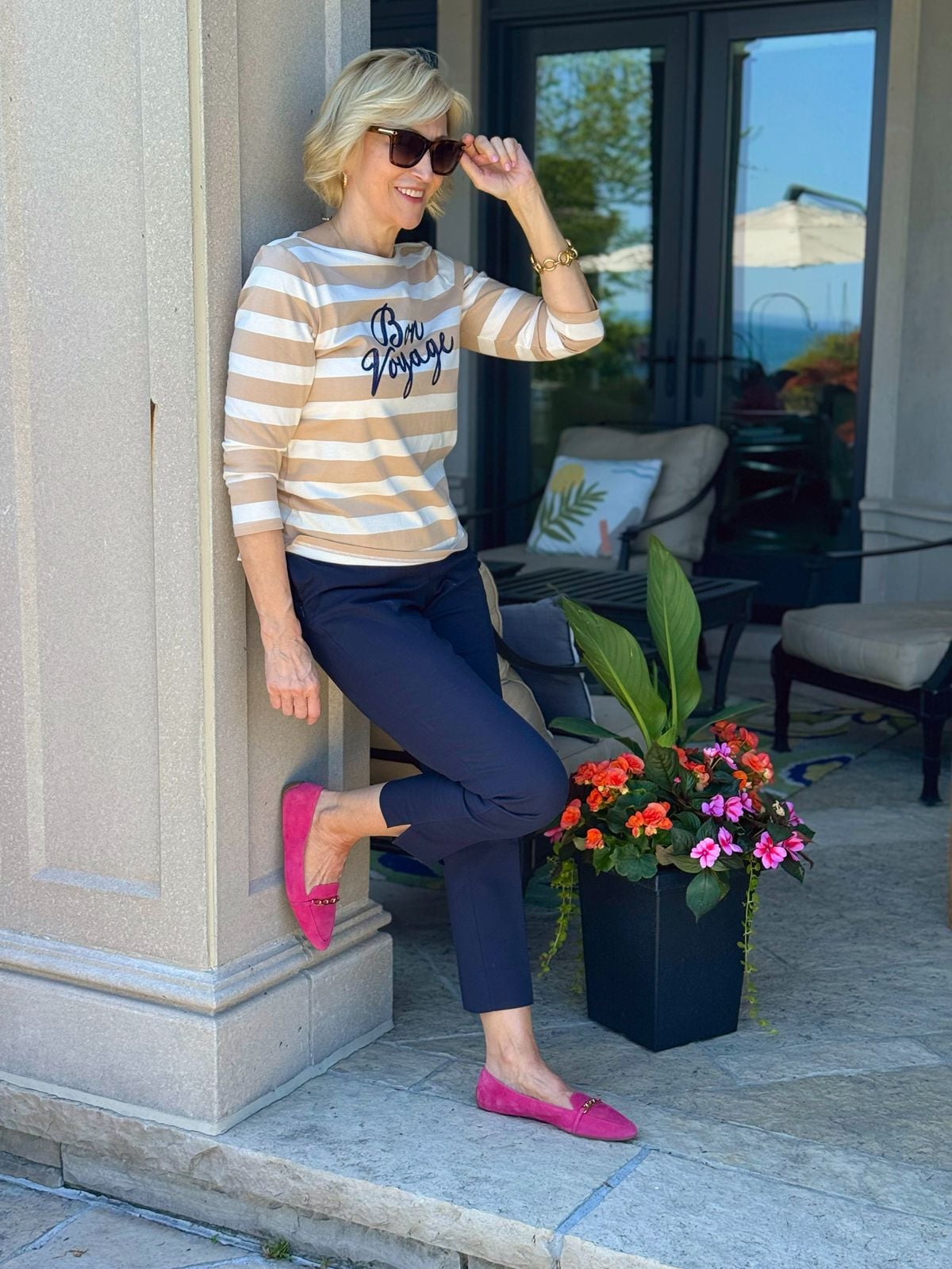 Bright pink loafers with navy capri pants for a colorful summer outfit