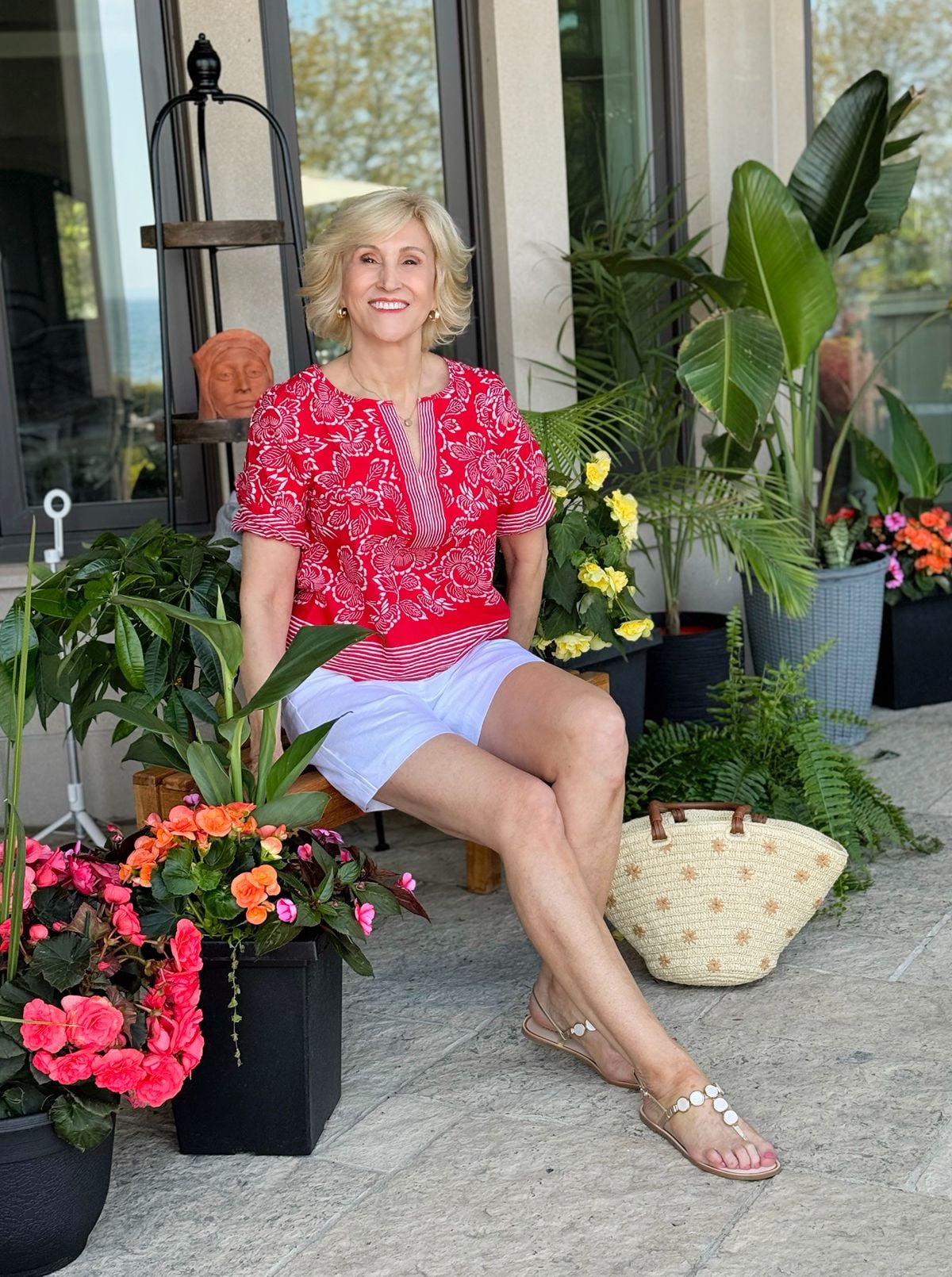 white linen shorts, red print split neck top