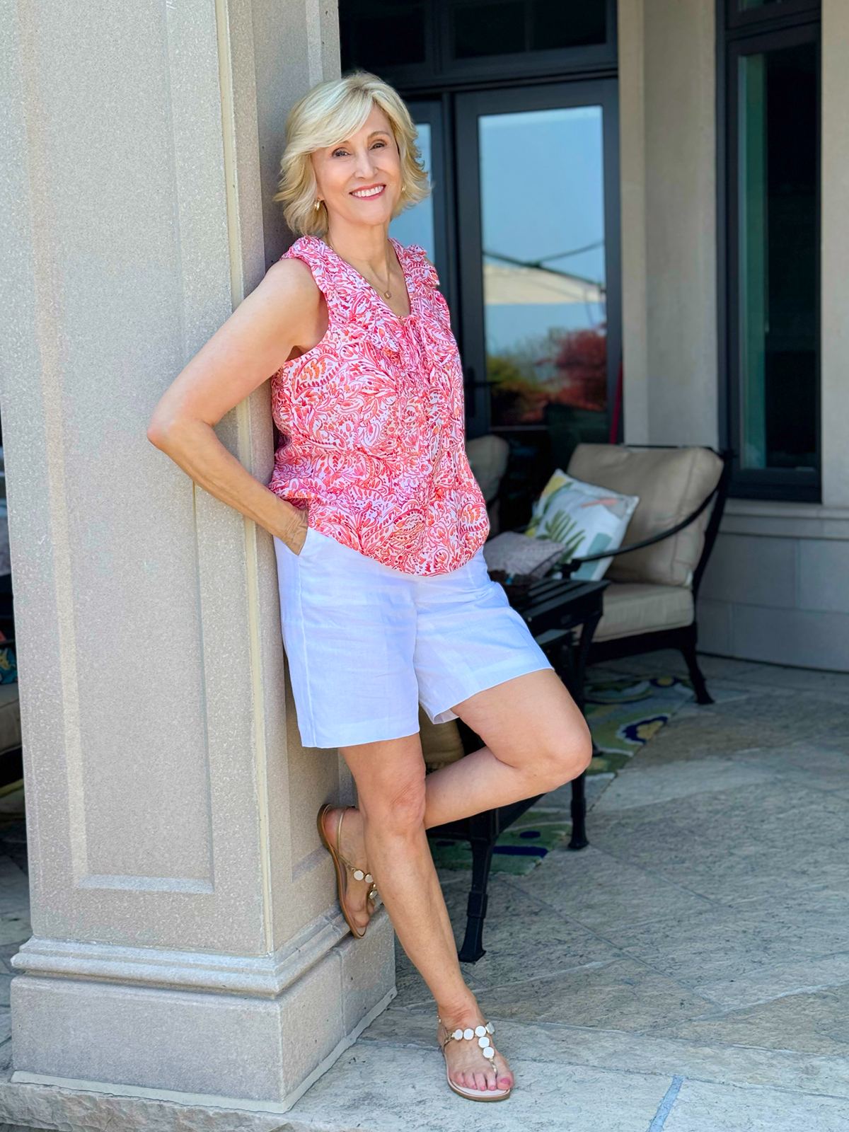 white linen shorts, pink and orange sleeveless ruffle top