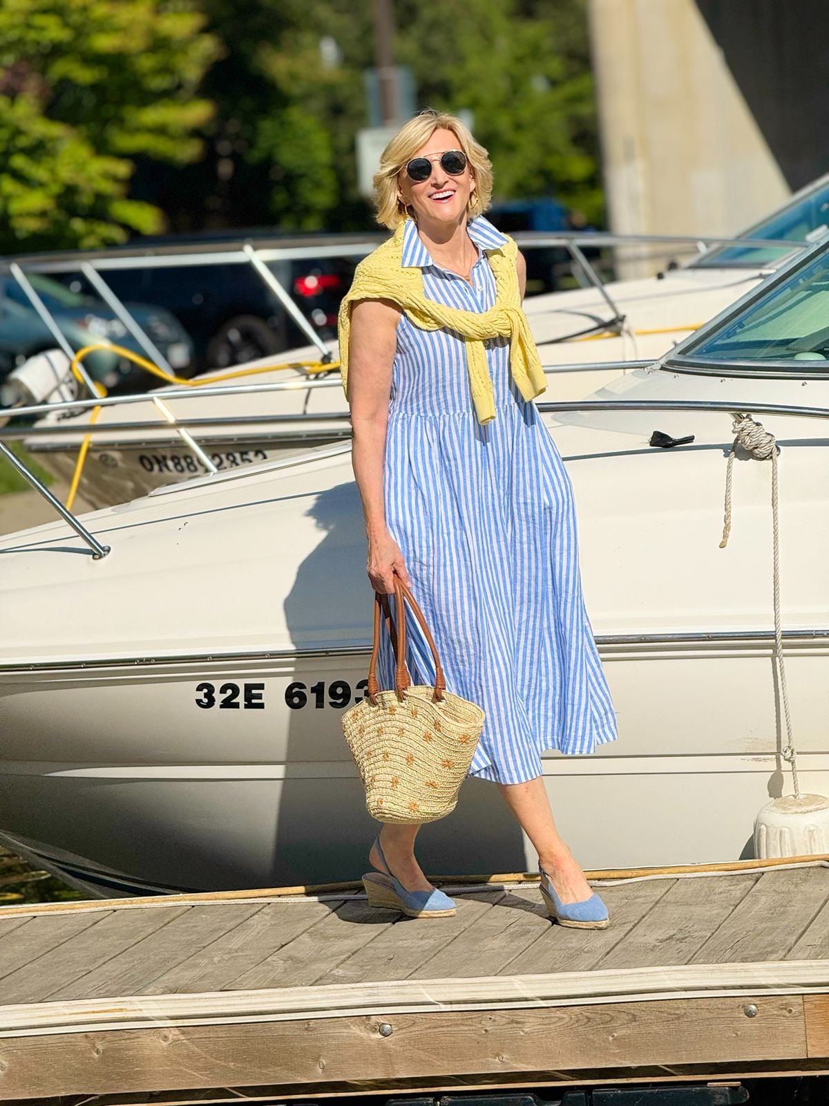 Deborah Boland in a blue striped midi dress with espadrilles for a cool summer outfit instead of shorts