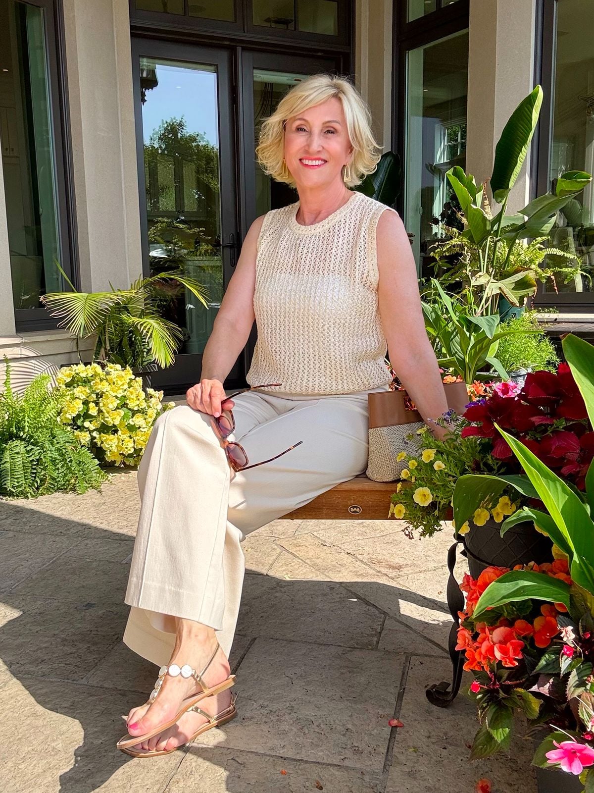 Deborah Boland wearing Lysse New York sequin mesh top with cream denim pants
