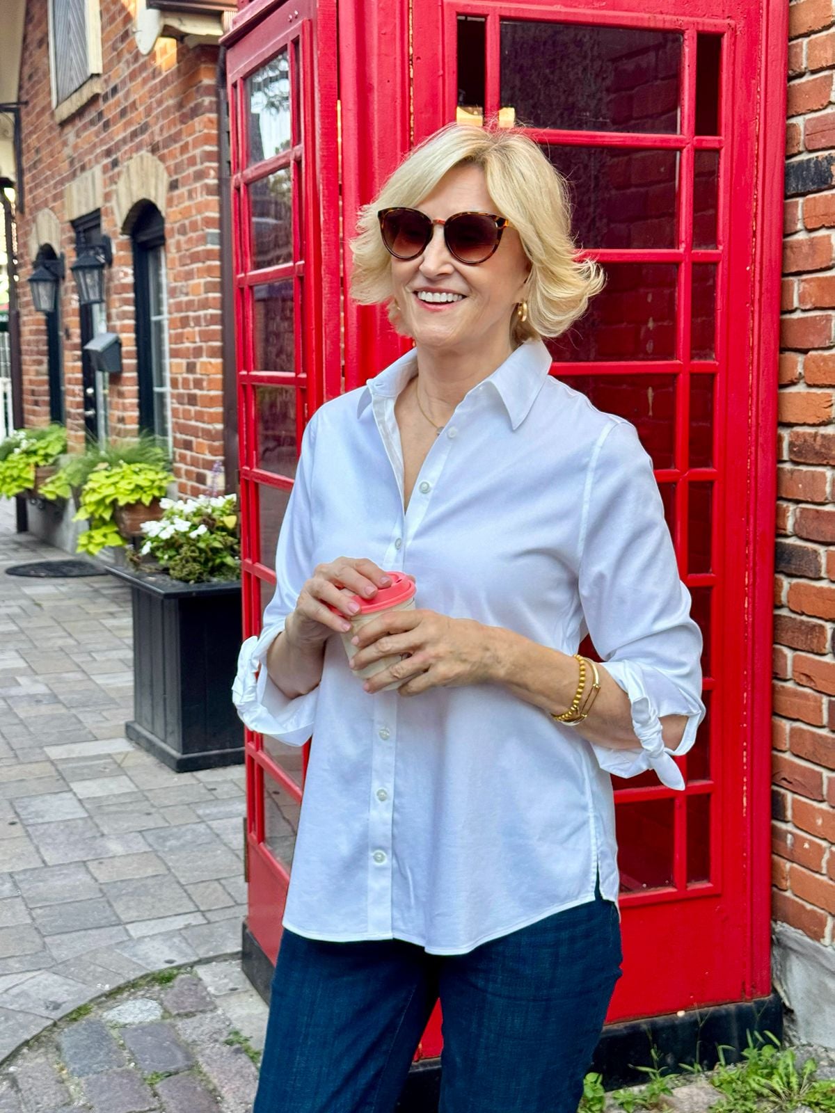 White no-iron button-down shirt for women styled with dark wash jeans